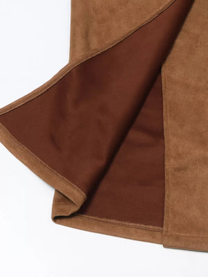 Brown midi skirt with slit detail, showing faux suede fabric and lining.