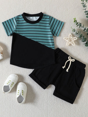 Baby two-piece set with striped blue and black t-shirt and black shorts.