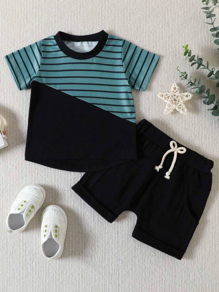Baby two-piece set with striped blue and black t-shirt and black shorts.