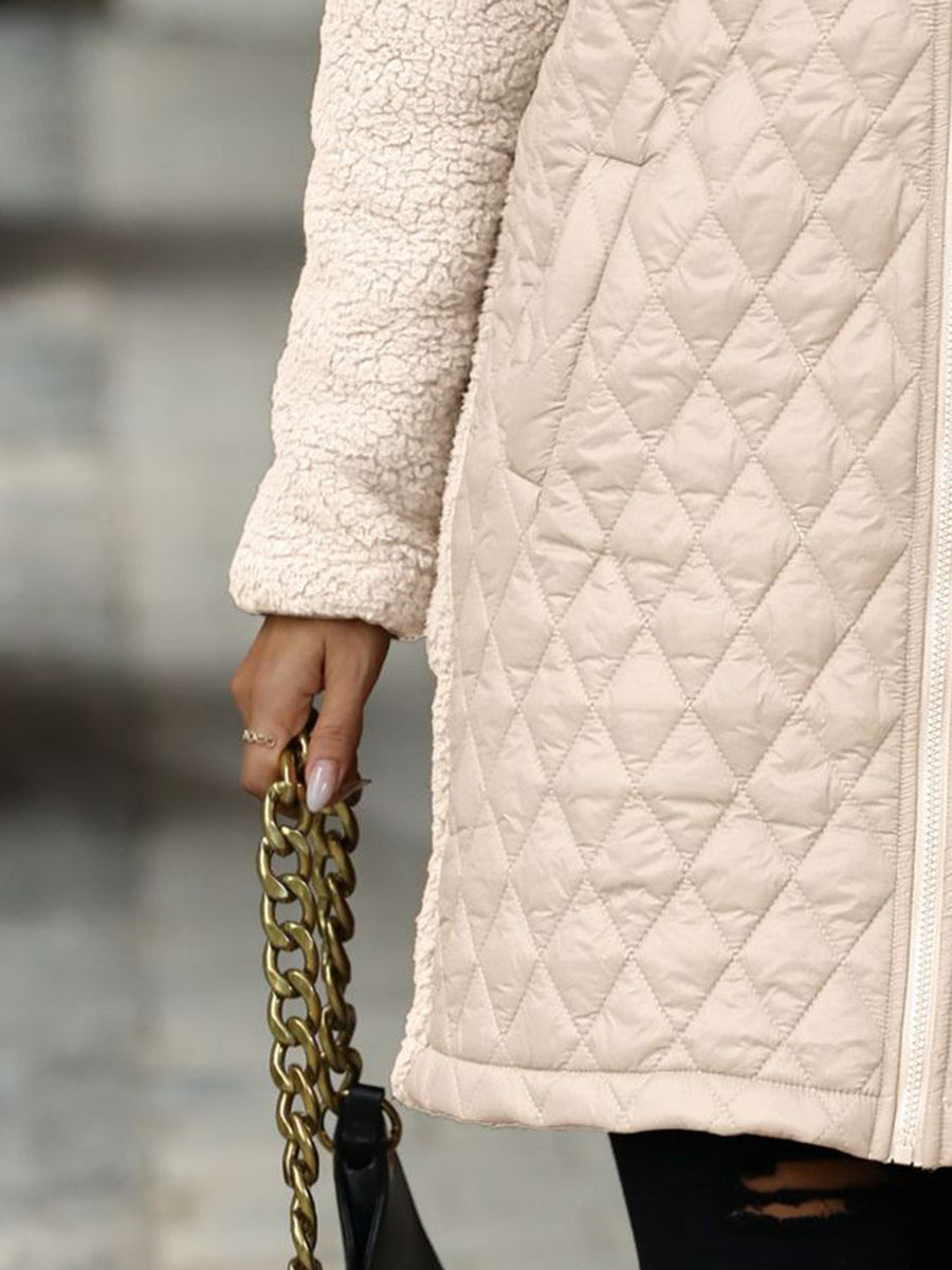 Eggshell teddy and quilted hybrid coat with sherpa sleeves and diamond quilting detail.
