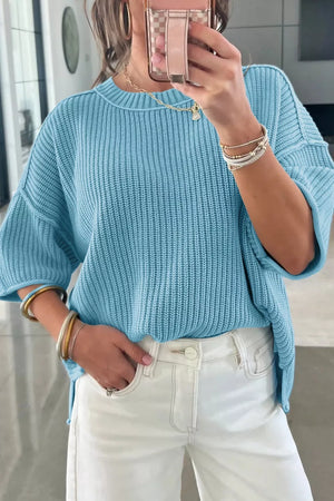 Relaxed blue ribbed knit sweater top with crew neck and short sleeves.