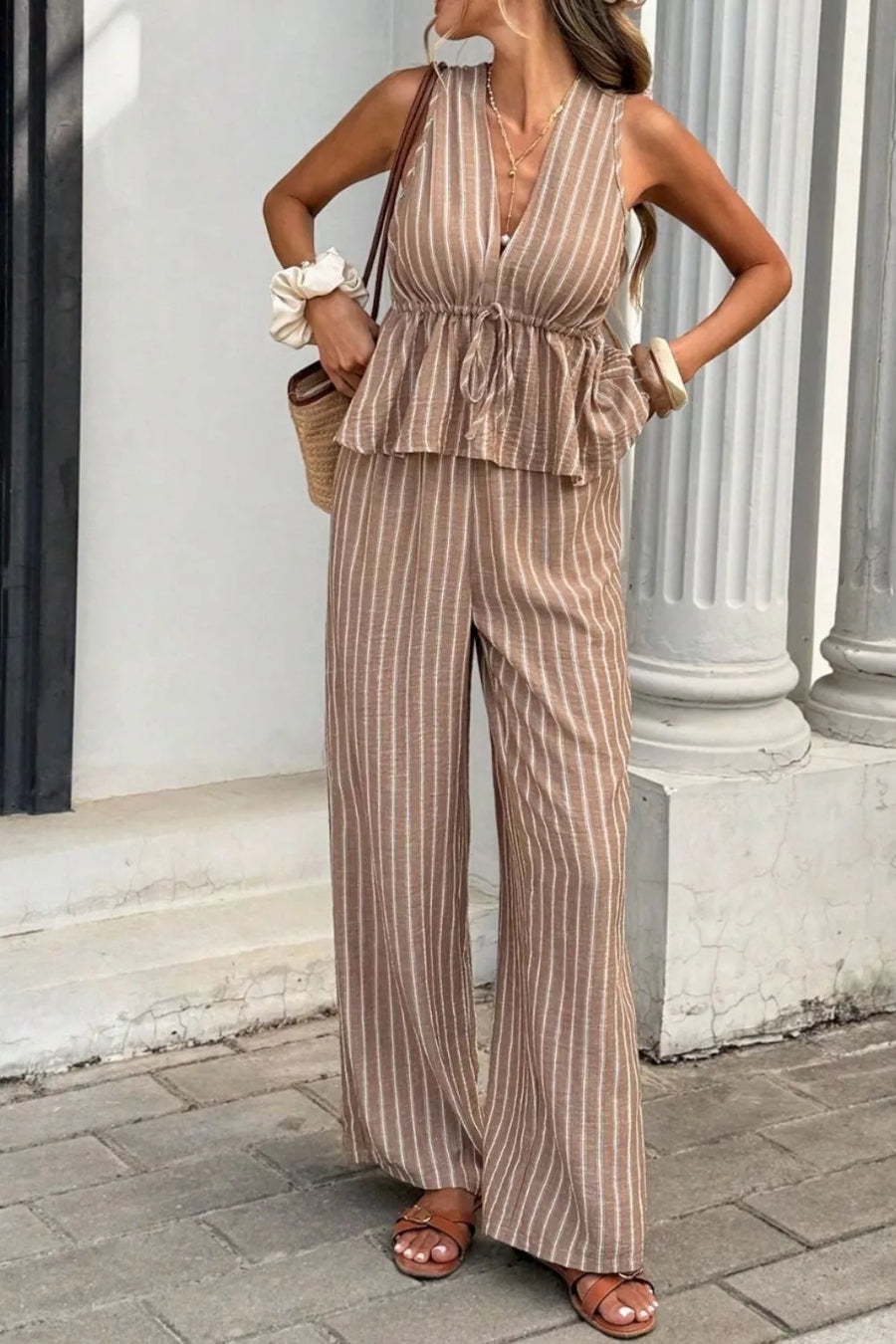 Chic striped two-piece set in camel with peplum top and wide-leg pants.