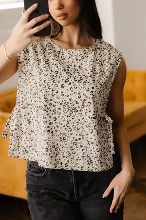 Knot detail leopard print tank top in cream and black with a crew neck.