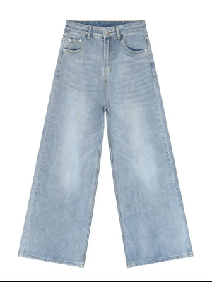 Light blue denim palazzo trousers with a wide leg and buttoned fly.