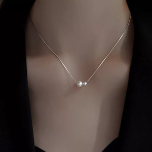 Synthetic Pearl,925 sterling silver Care instructions: Avoid wearing during exer necklace in Cream with straight silhouette