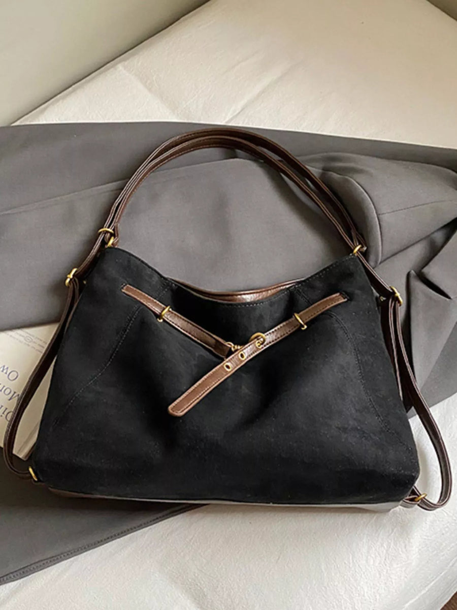 Black suede large tote bag with brown leather trim and strap details