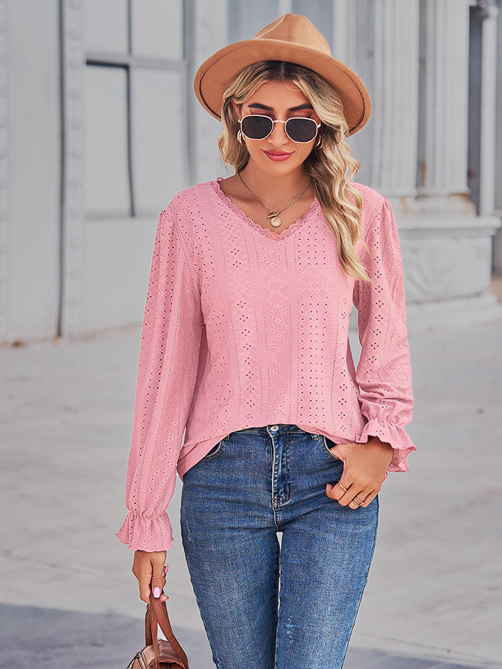 Blush pink lace-cut prairie blouse with eyelet details and ruffled sleeves.