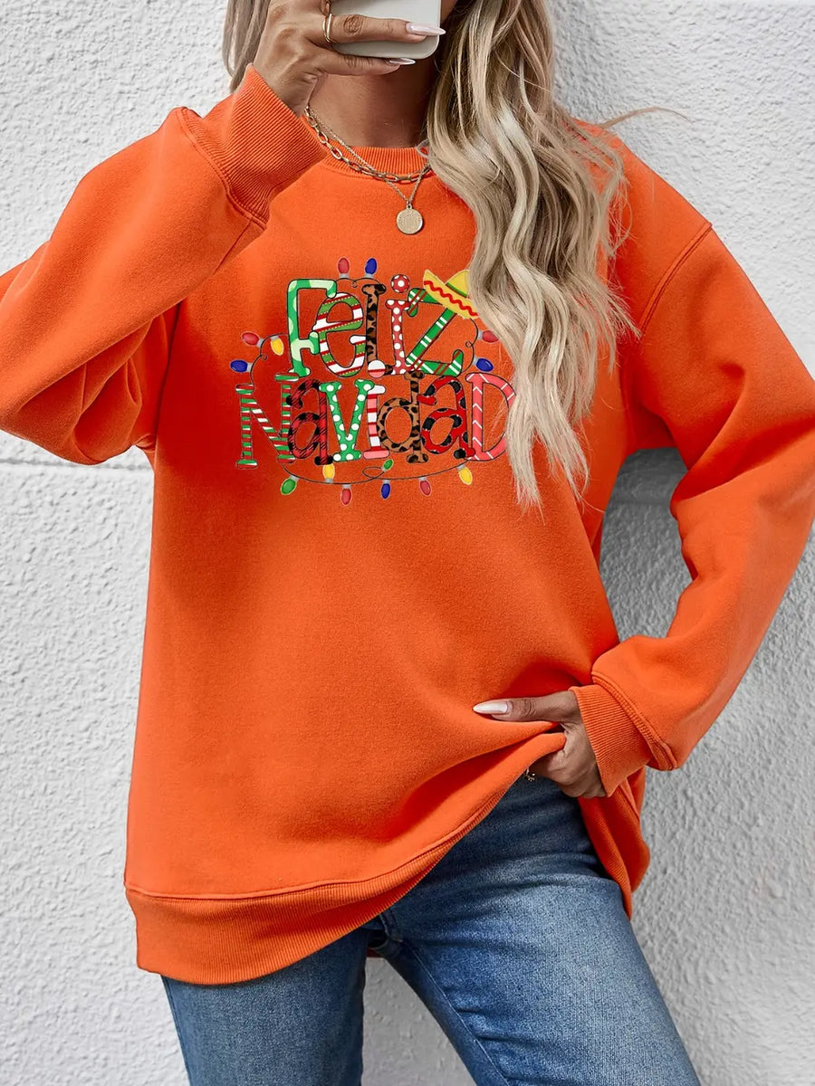 Orange graphic sweatshirt with Feliz Navidad text and Christmas lights.