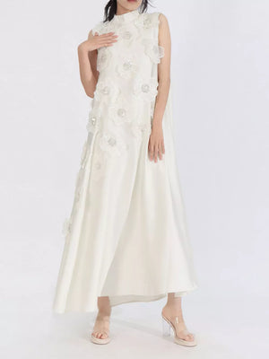 White sleeveless maxi dress with floral applique and sequin details, high neckline