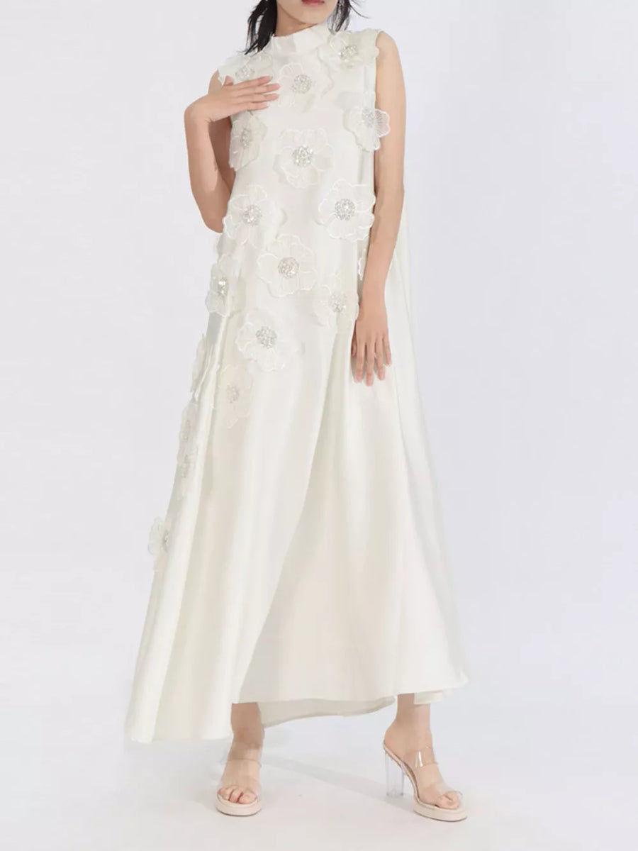 White sleeveless maxi dress with floral applique and sequin details, high neckline
