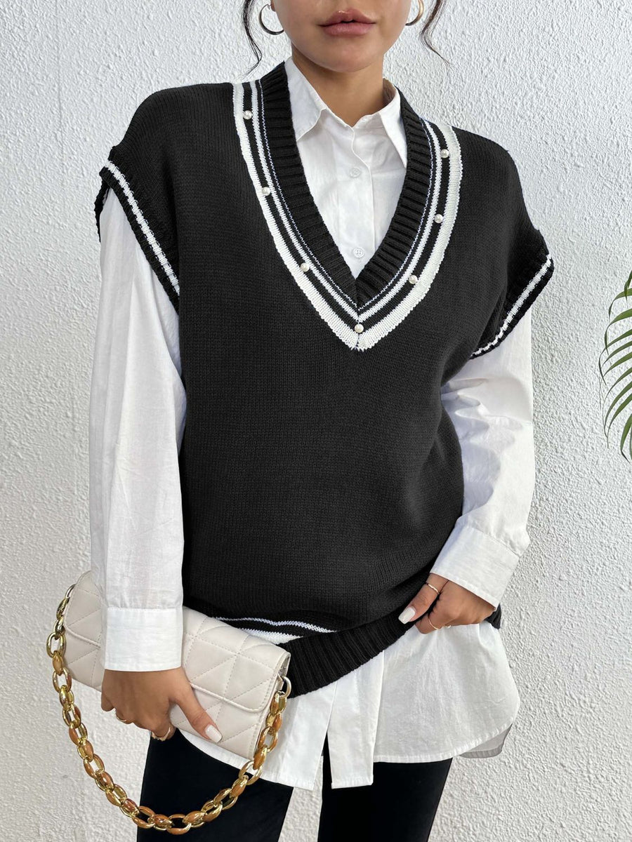 Black acrylic knit vest with varsity stripes and pearl trim on V-neck and armholes.