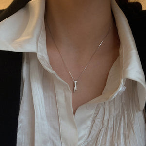 Sterling silver pendant necklace with zircon accents on a box chain