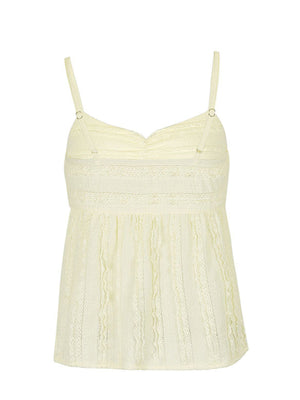 Light yellow textured sweetheart neck cami top with lace trim and adjustable straps.