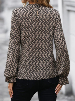 Tied ruffled flounce sleeve blouse in khaki with a geometric print and mock neckline.