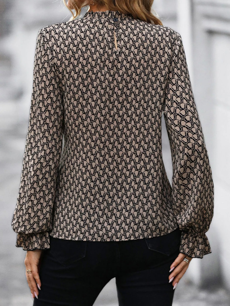 Tied ruffled flounce sleeve blouse in khaki with a geometric print and mock neckline.