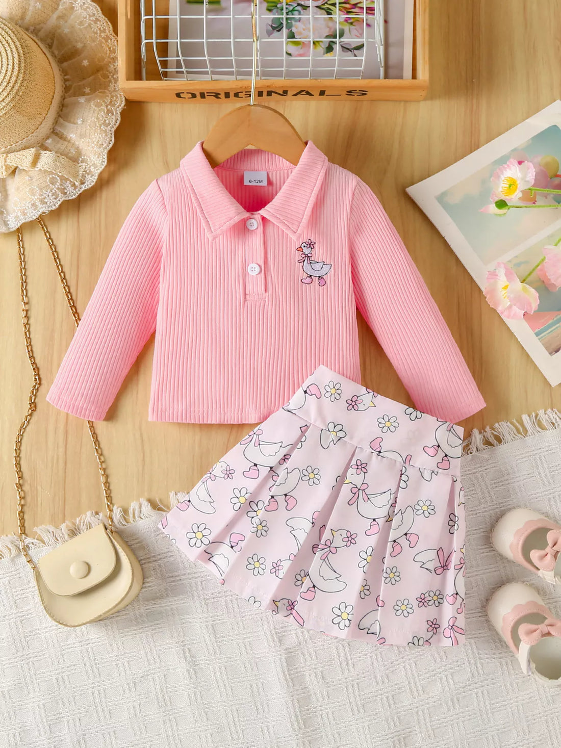 Pink ribbed polo with duck embroidery and pleated duck print skirt set