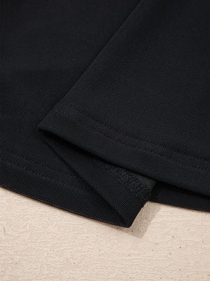 Black sheer mesh t-shirt with cap sleeves, showing fabric texture and seams.