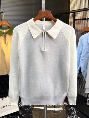 Men's white quarter zip sweater with a collar and ribbed texture.