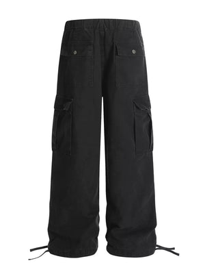 Black cargo pants with adjustable drawstring cuffs and multiple pockets.