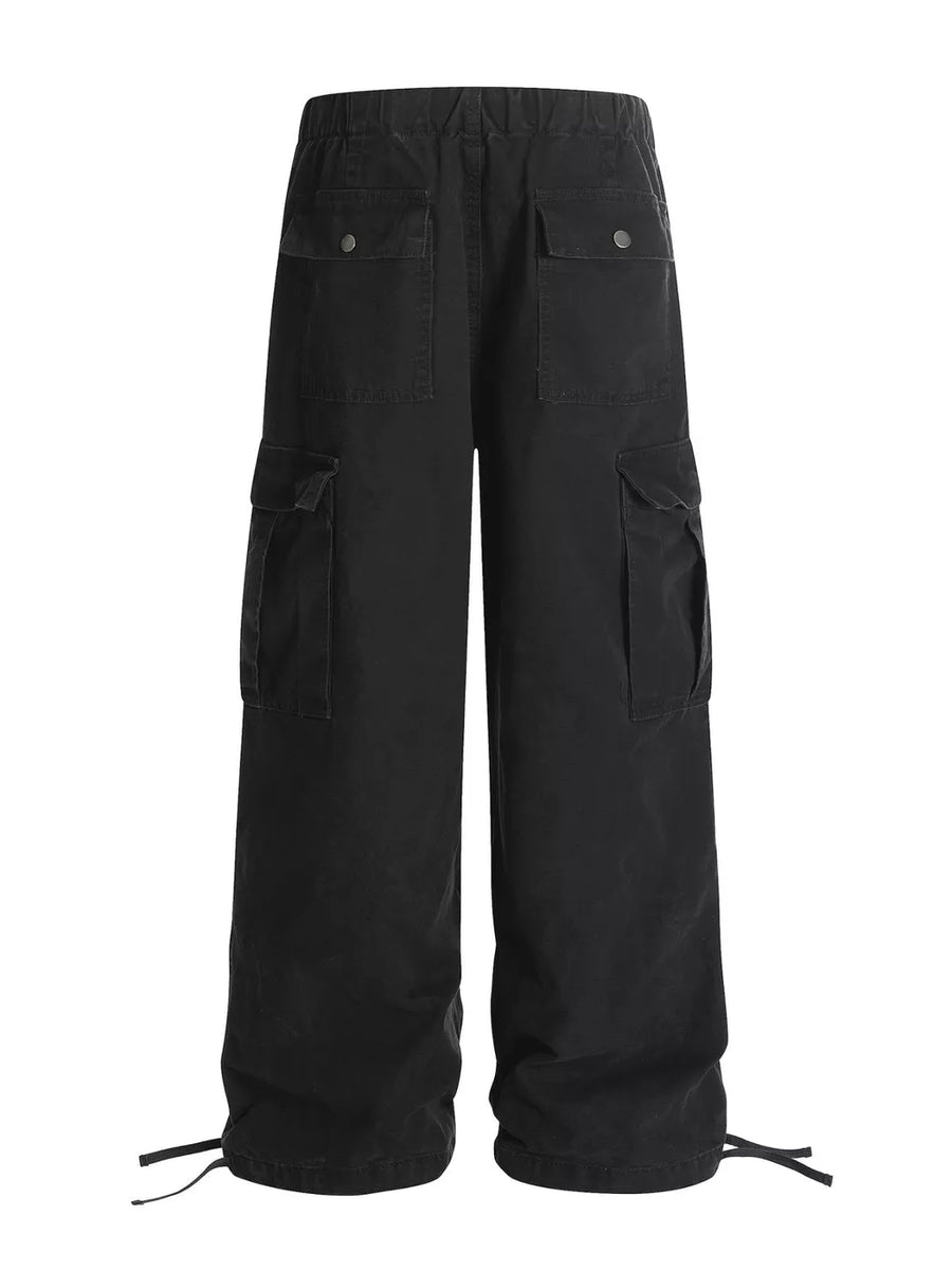 Black cargo pants with adjustable drawstring cuffs and multiple pockets.