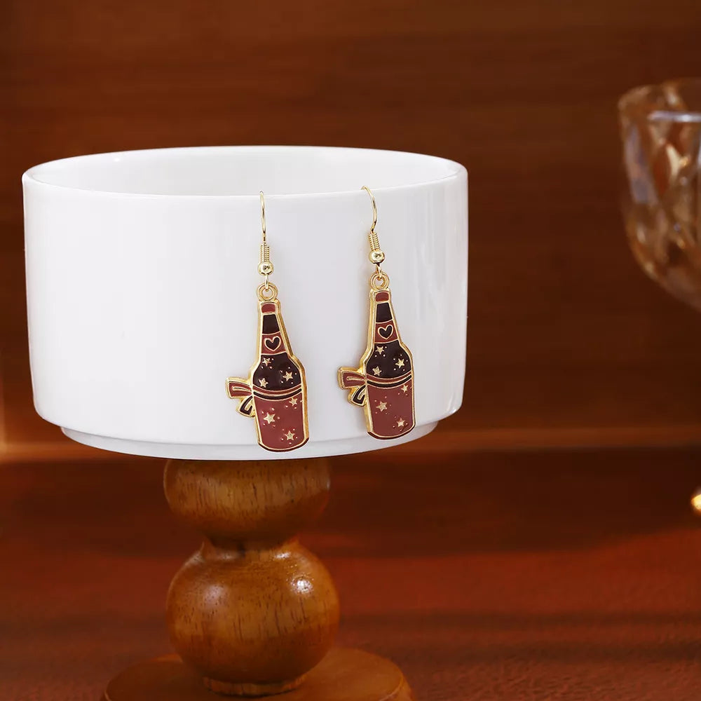 earrings featuring cow print in gold with 18K Gold-Plated, Resin, Zinc alloy Care instructions: Avoid wearing during exerc
