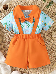 Baby bodysuit and shorts set with bunny and carrot print, orange collar, bow tie, and suspenders.