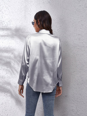 Silken button-down shirt in light gray with long sleeves and a relaxed fit.