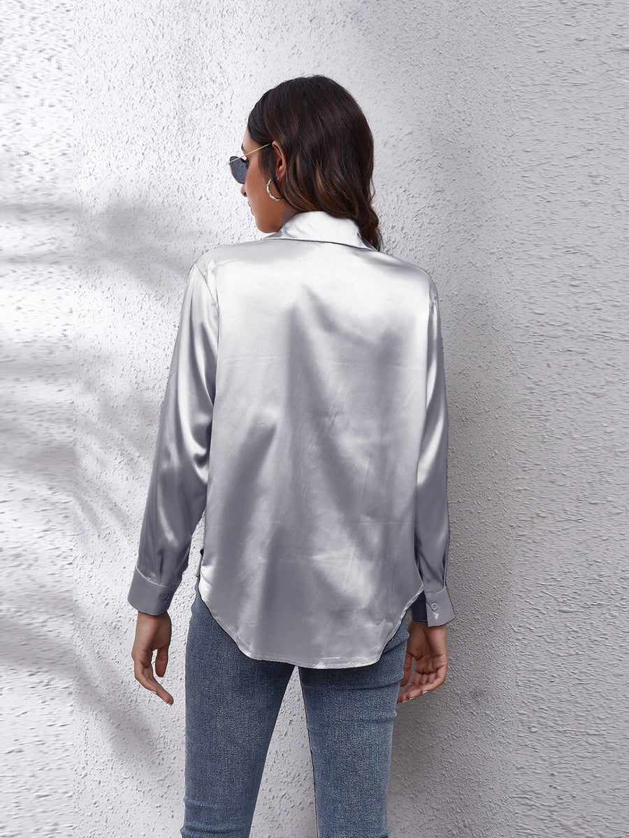 Silken button-down shirt in light gray with long sleeves and a relaxed fit.