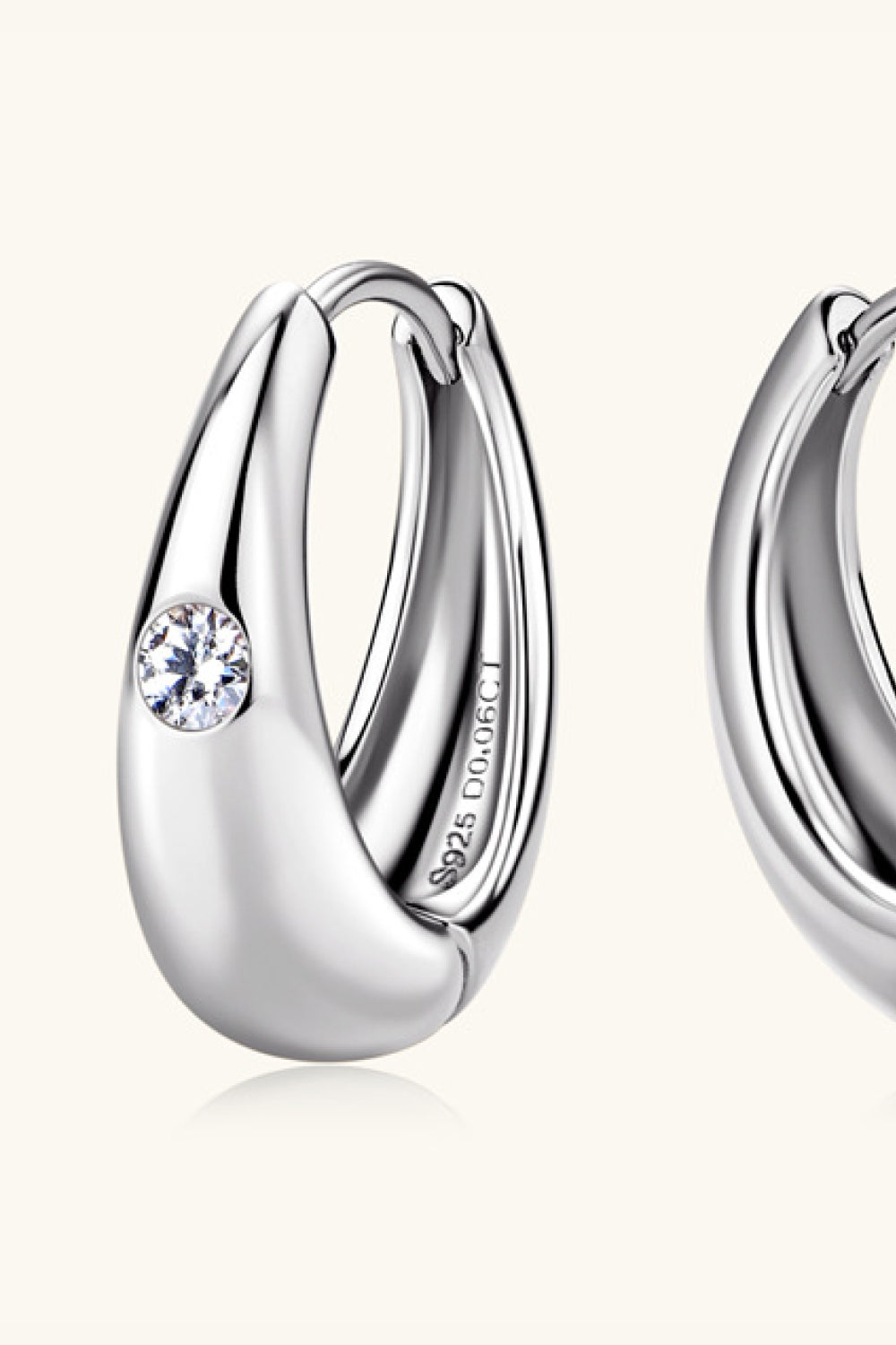 Silver hoop earrings with crystal accent, made of 925 sterling silver.