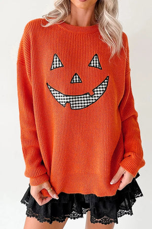 Orange pullover sweater featuring drop shoulder and graphic print