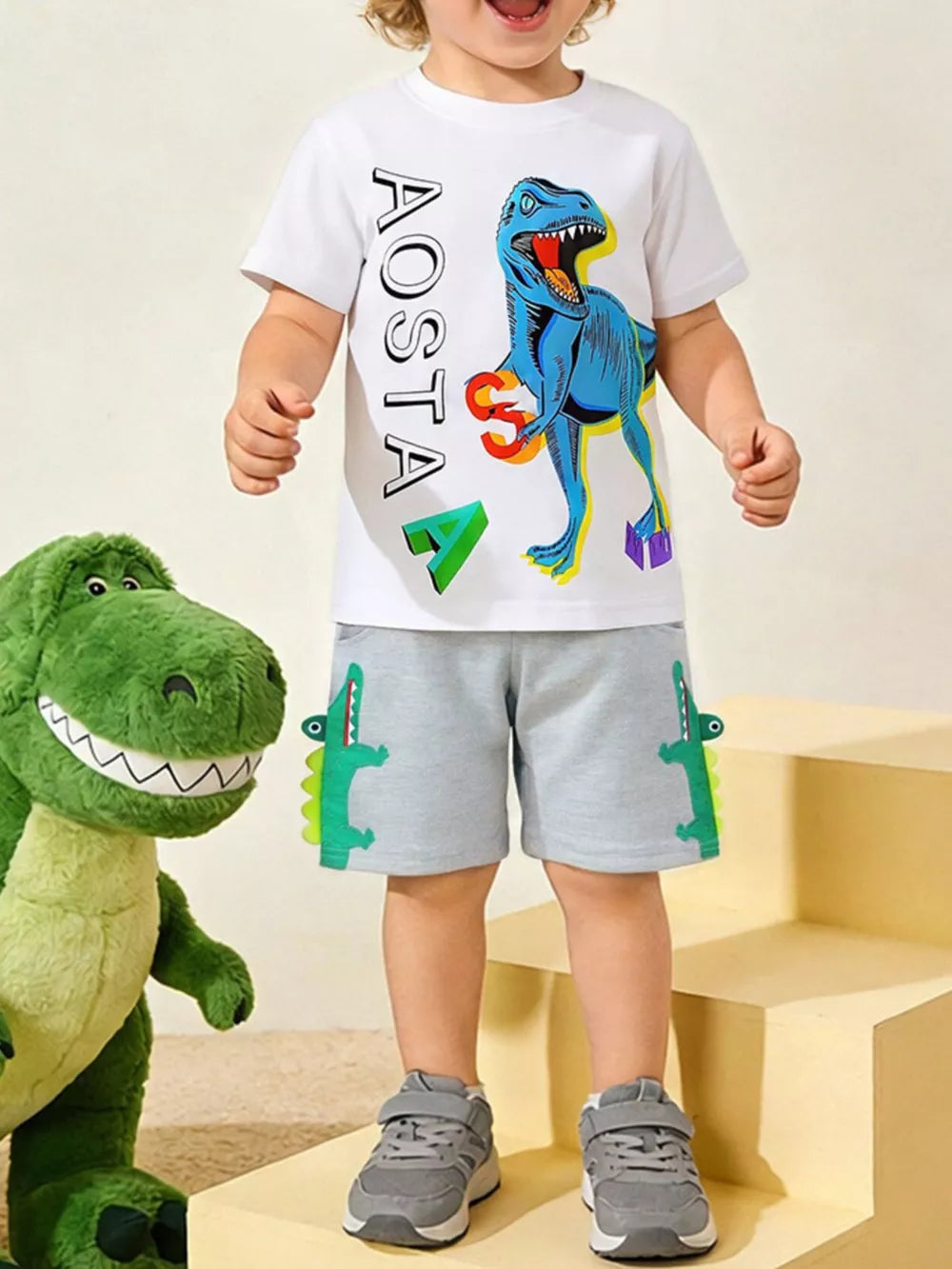 Boys' cotton graphic tee and shorts set with blue dinosaur and alligator applique.