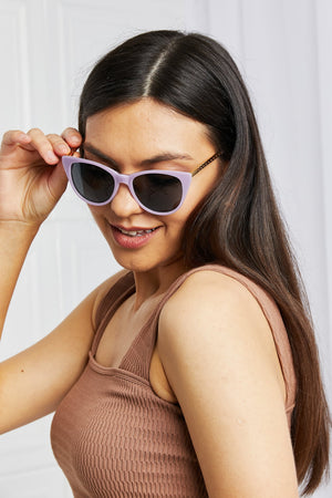 Lavender cat-eye acetate sunglasses with chain detail on temples