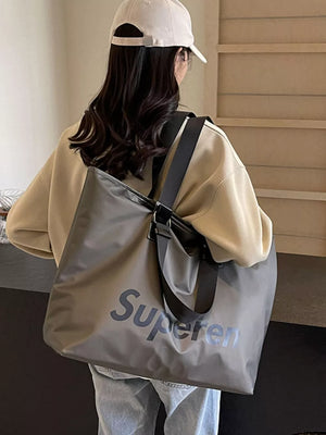 Spacious grey Oxford cloth travel shoulder bag with dark grey "Superen" text graphic.