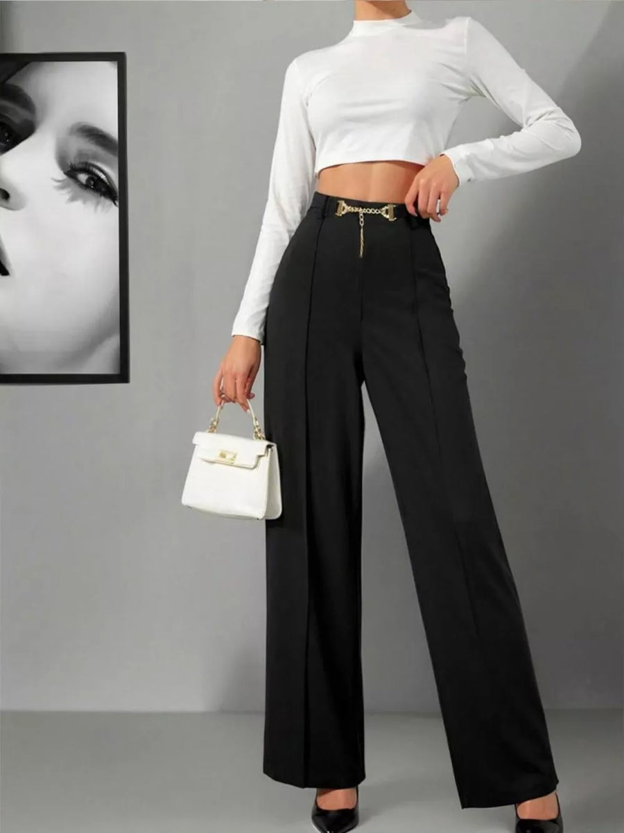Black wide-leg high-waist maternity trousers with gold chain detail at the waist.