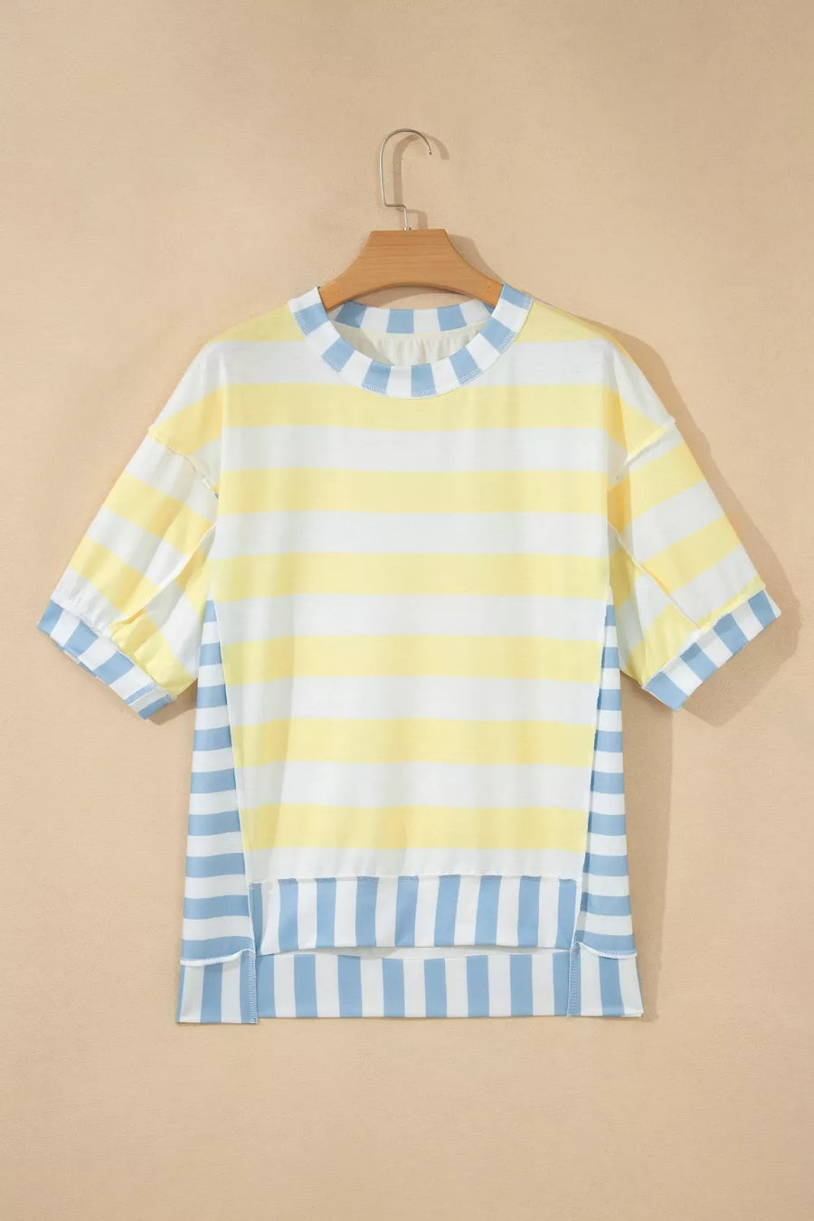 Striped t-shirt with yellow, white, and blue horizontal stripes and a crew neck.