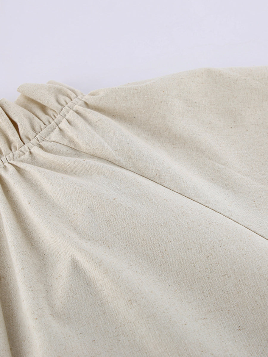 Beige cotton maxi dress with ruffled tie neck detail