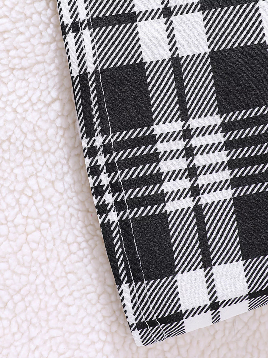 Children's black and white plaid fuzzy cardigan detail with sherpa lining.