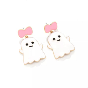 Playful ghost dangle earrings with pink bows and gold trim.