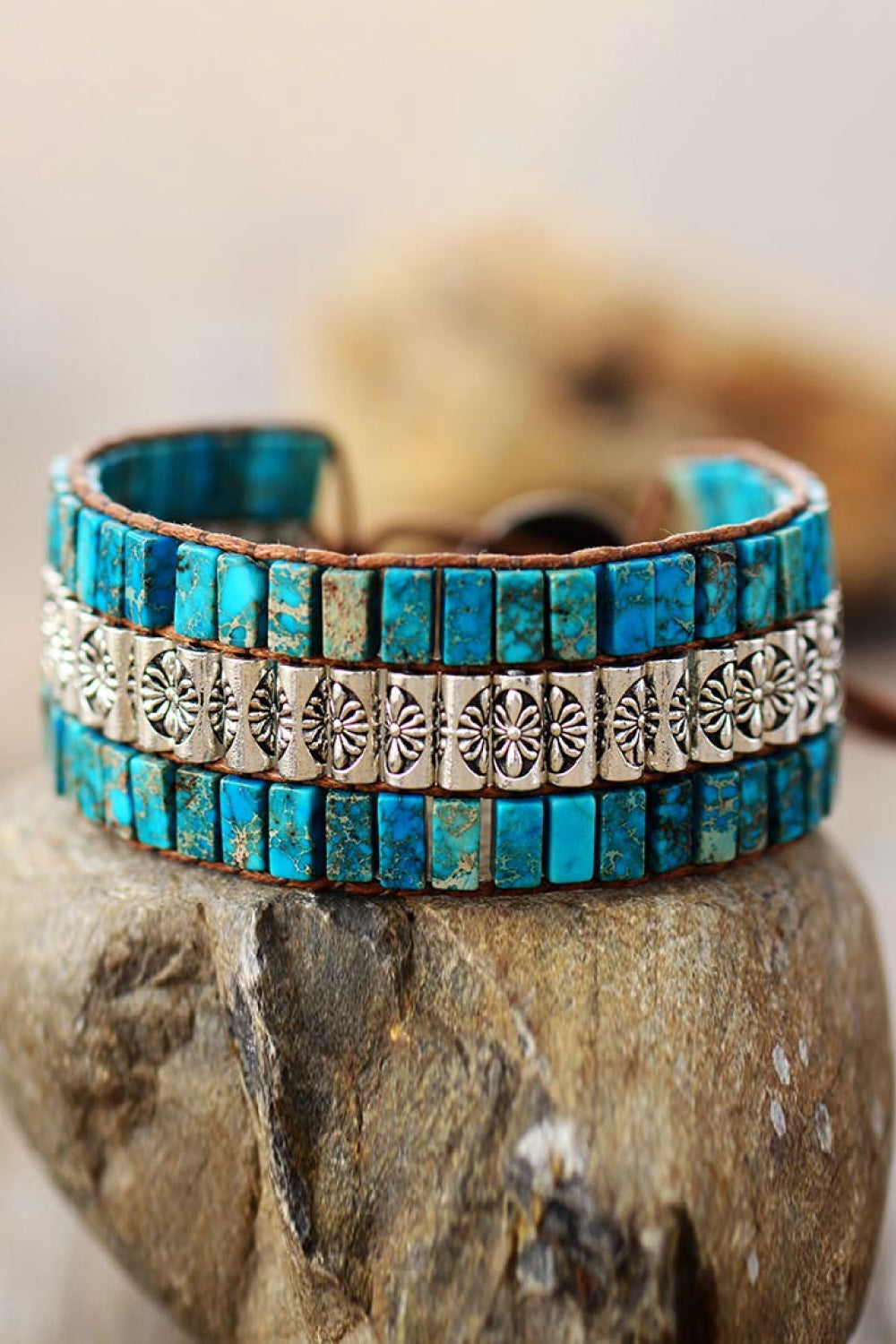 Turquoise tile and floral accent bracelet with leather backing, boho style.