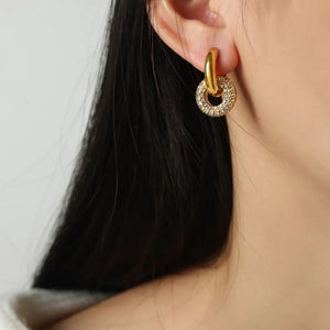 Gold pavé circle interlock earrings with a hoop detail.