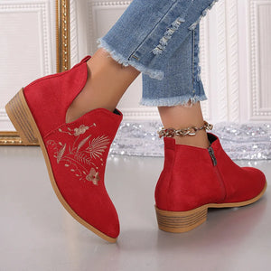 Red suede ankle boots with side zip and floral embroidery detail