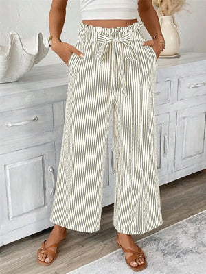 Maternity paper bag waist pants with tie in green and white vertical stripes.