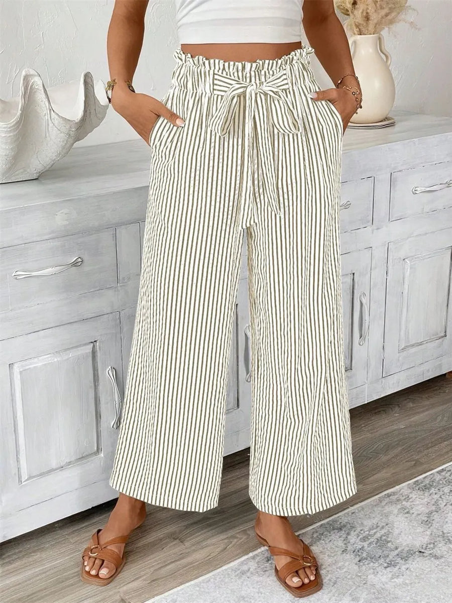 Maternity paper bag waist pants with tie in green and white vertical stripes.