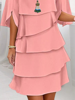 Coral ruffled layered flutter sleeve dress with tiered skirt and split sleeves.