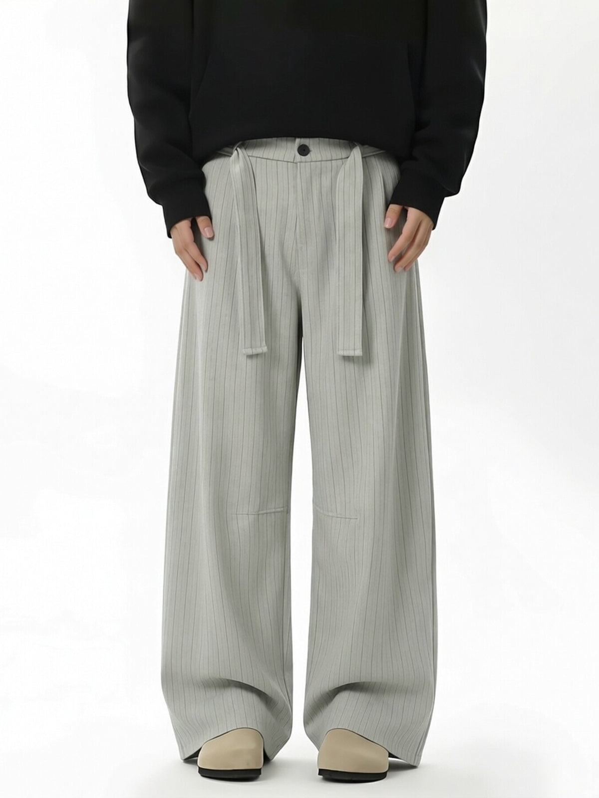 wide-leg pants in light gray featuring belted and flared fit