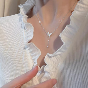necklace in silver featuring butterfly pendant and straight fit