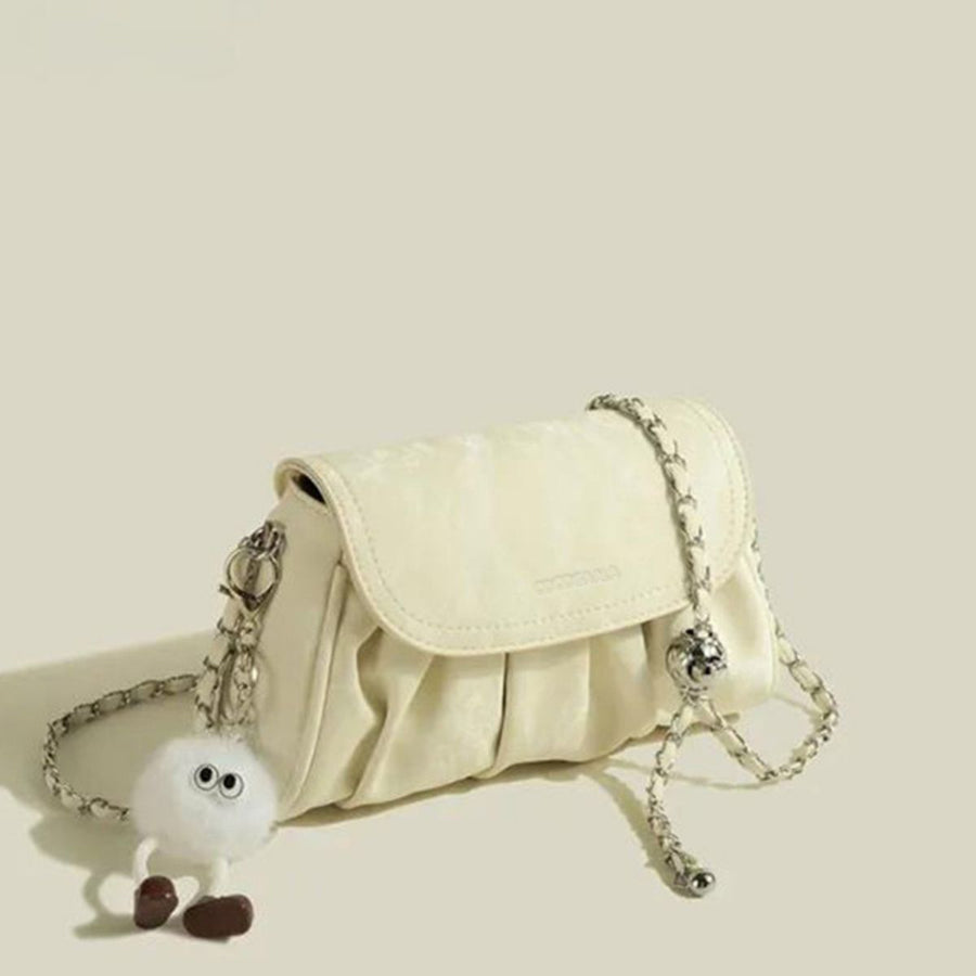 Mini ruched pu leather shoulder bag in pastel yellow with chain strap and fuzzy charm