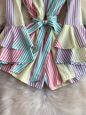 Color striped romper with tiered ruffles and a bow belt detail.
