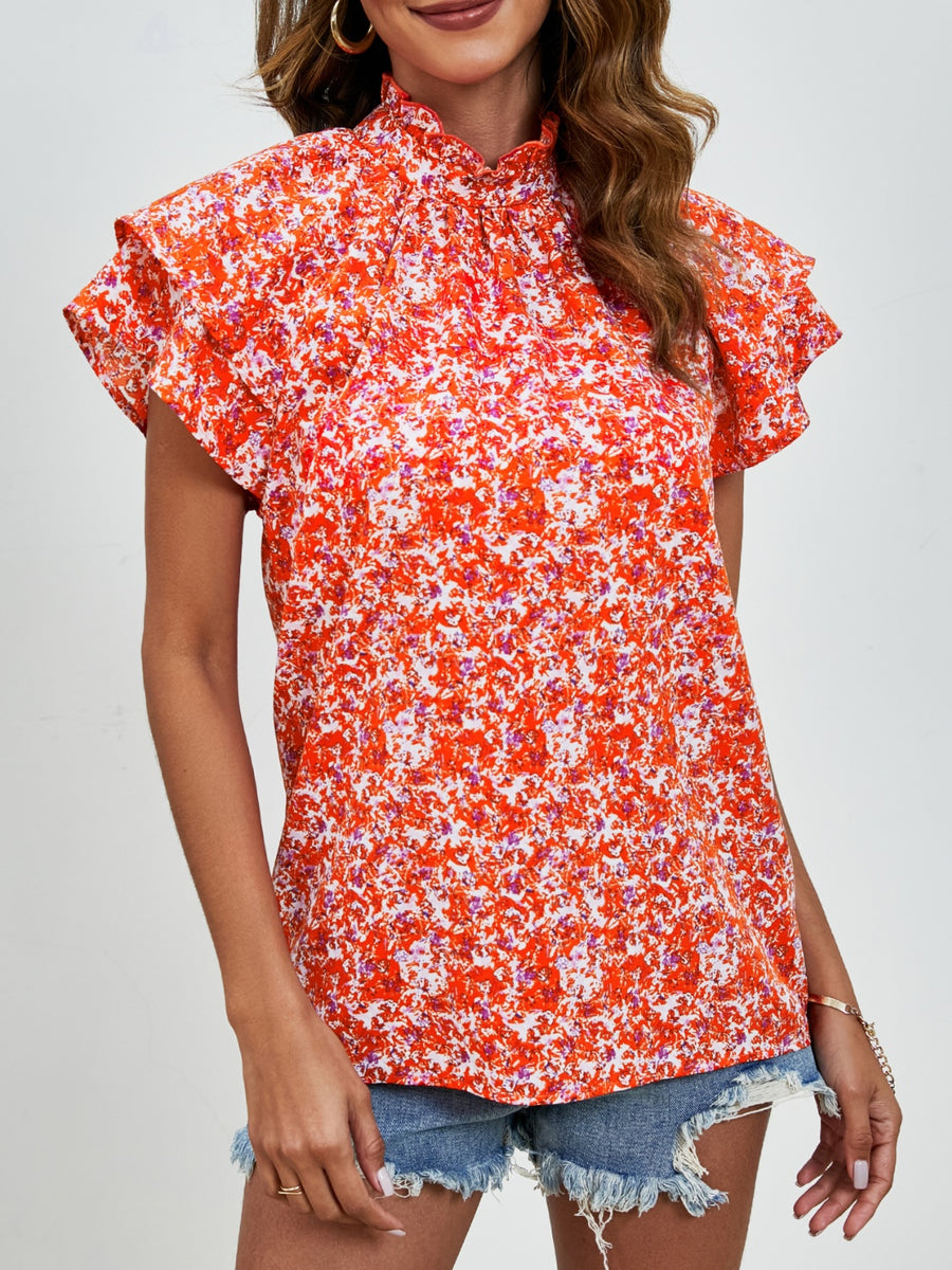 Orange floral blouse with ruffled neckline and flutter sleeves