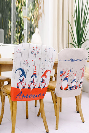 Patriotic gnome chair covers with fireworks and stars, one says America.